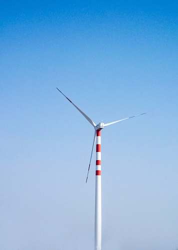 machine white and red windmill during daytime engine